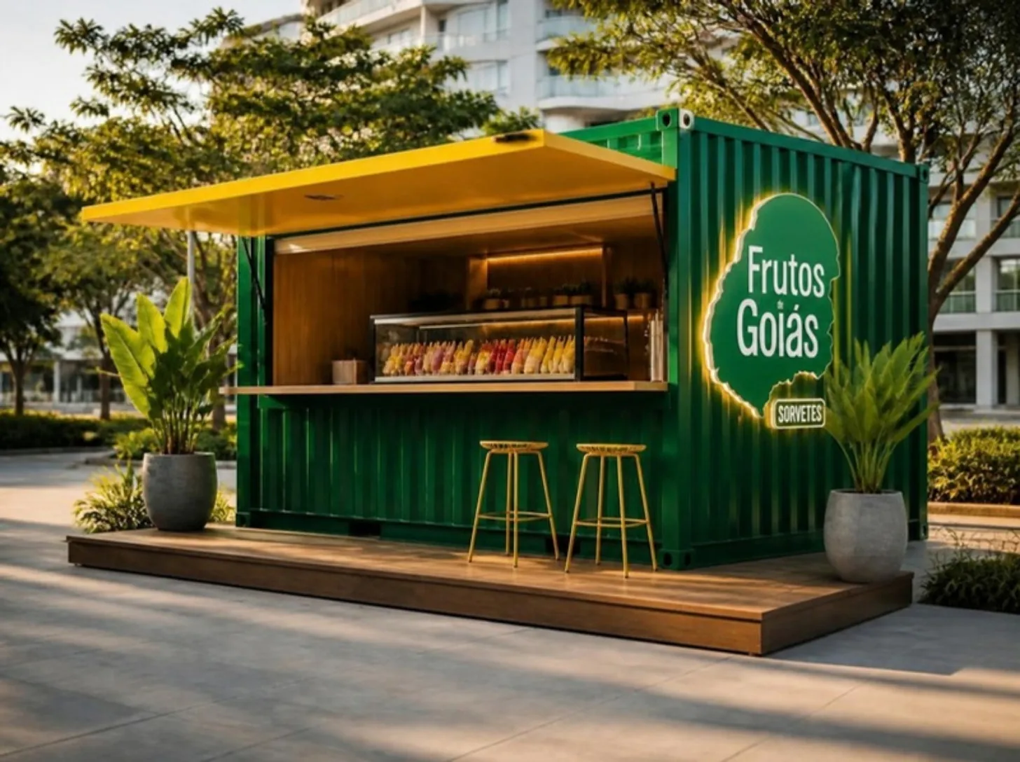 Imagem ilustrativa: loja Container Frutos de Goiás, verde com toldo amarelo e logo da marca na lateral